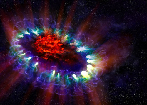 Esta representación artística de la supernova 1987A revela las zonas frías presentes al interior del remanente de la estrella extinta (en rojo), donde ALMA detectó y convirtió en imagen enormes cantidades de polvo. Créditos: A. Angelich; NRAO/AUI/NS