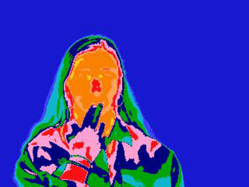 Imagen termográfica de una persona con amor de ternura (sube la temperatura en las manos y la cara)./UGR.