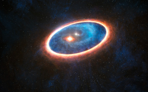 Esta ilustración muestra el polvo y el gas alrededor del sistema estelar doble GG Tauri-A. Utilizando ALMA, los investigadores han detectado gas en la región entre los dos discos de este sistema binario. Crédito: ESO/L. Calçada